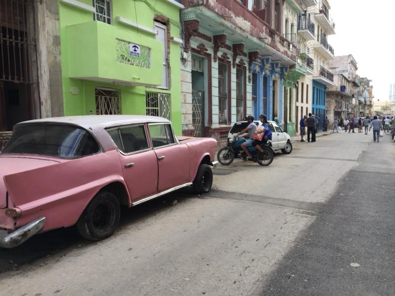 Classic car on a colorful Havana street